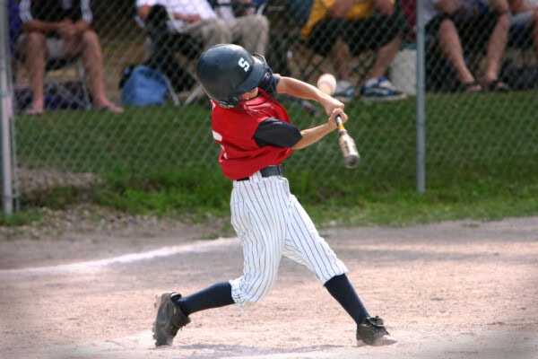 baseball player hitting foul ball